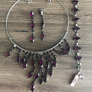 Purple necklace, earring, and bracelet set.